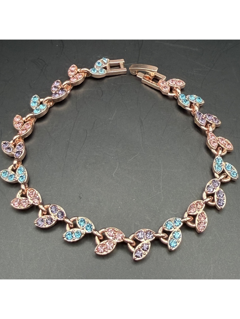 candy+clover Rose Gold Tone Leaf Link Bracelet with Pink, Blue, and Purple Cryst